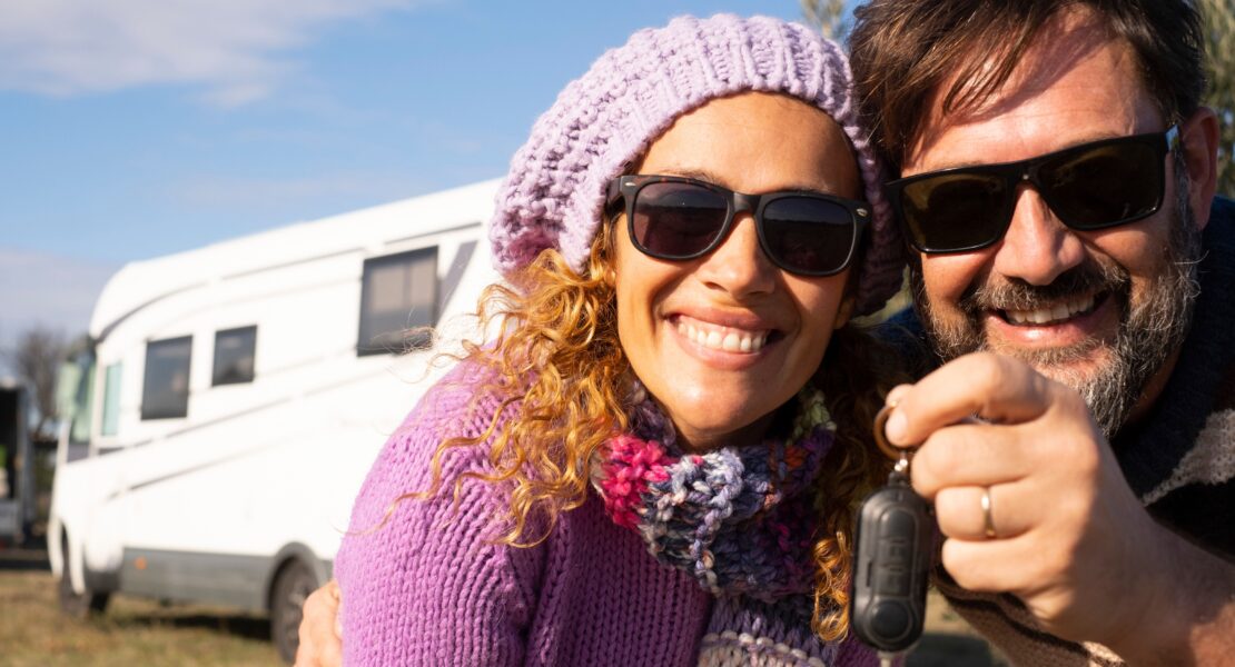 Man and woman in front of a motorhome